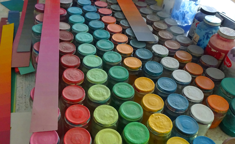 Color paint jars in Julian's studio.